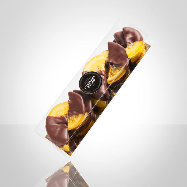 Boite de demi tranches de citrons confis enrobées en partie de chocolat noir