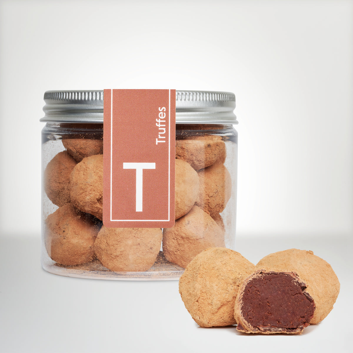 Pot de 120g de truffes au sirop d'érable avec une truffe coupée en deux